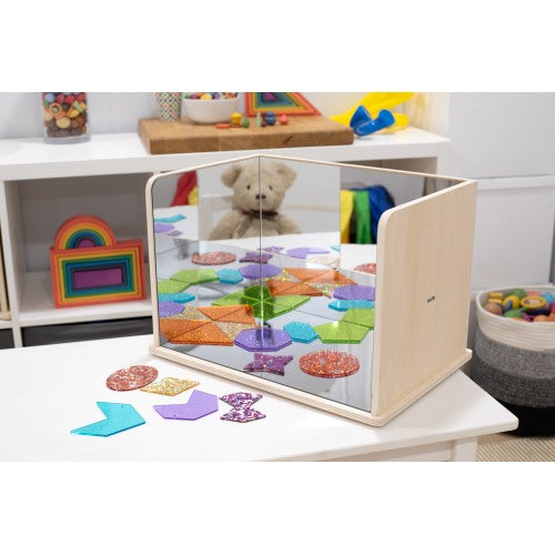 Wooden exploratory mirror with light wood frame and colorful reflective floor tiles