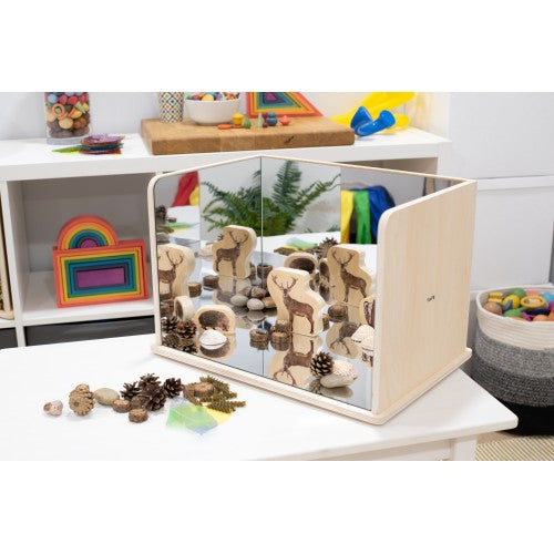 Wooden exploratory mirror with mirrored panels and safari animal cutouts on display