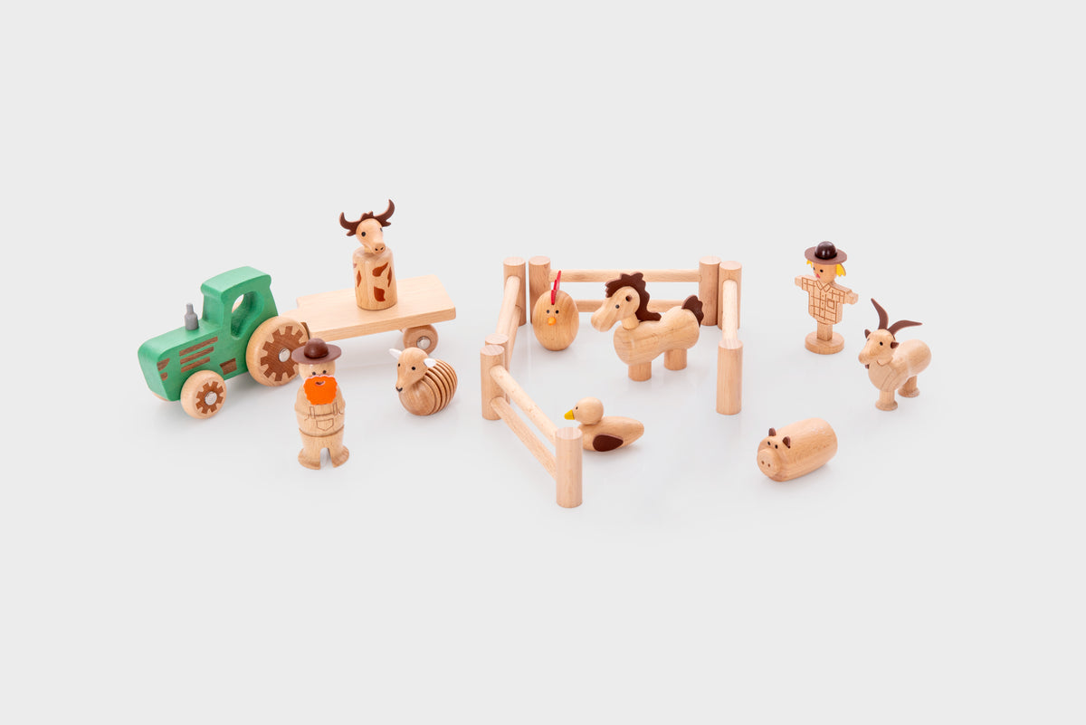 Wooden farm toy set with tractor, fence pen, barn and animal figures