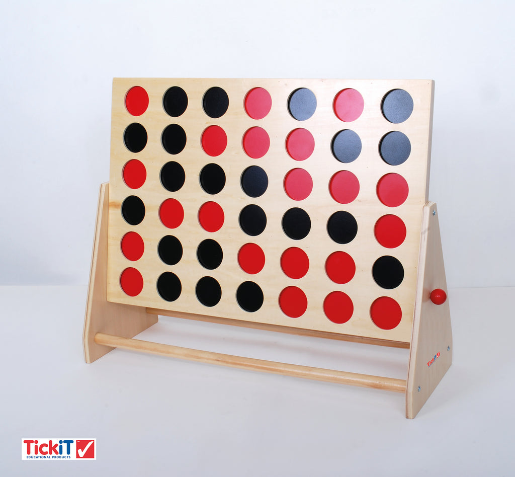 Wooden Connect Four board with red, pink, black, and blue disc slots