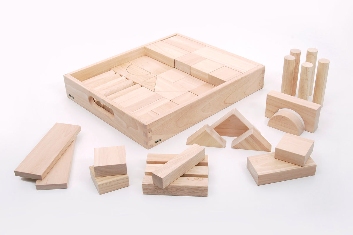 Wooden jumbo block set with loose wooden blocks, arches, and cup-like pieces