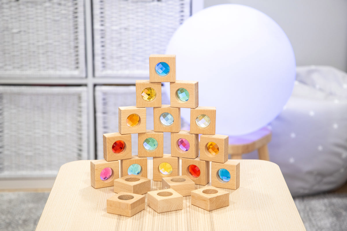 Stacking wooden kaleidoscope blocks with circular colored discs and hexagon/rectangular base pieces