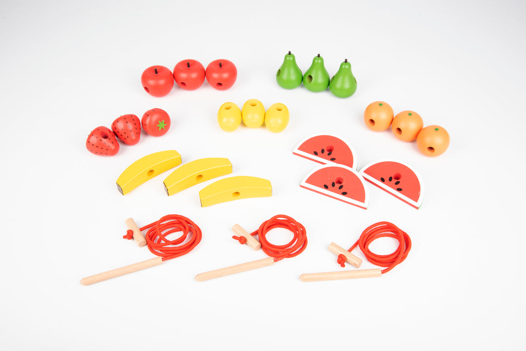 Wooden lacing fruit pieces: watermelon slices, bananas, pears, and red laces