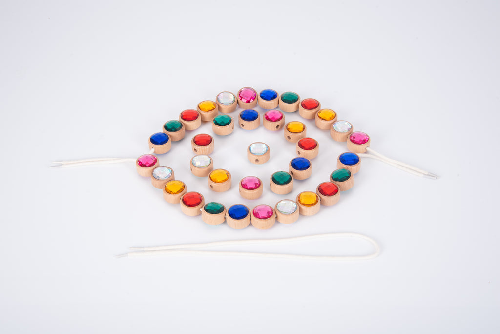 Wooden lacing jewels circular bead set with colorful beads on white lace