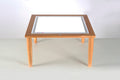 Wooden light table with clear rectangular light panel and four short legs