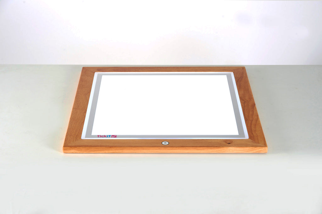 Wooden light table angled view of recessed rectangular light panel in wooden base