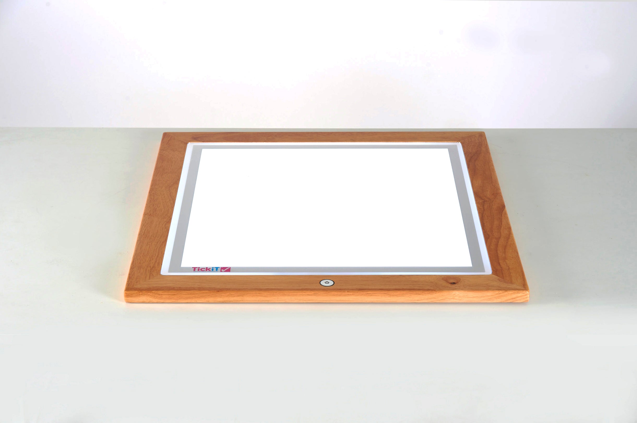 Wooden light table angled view of recessed rectangular light panel in wooden base