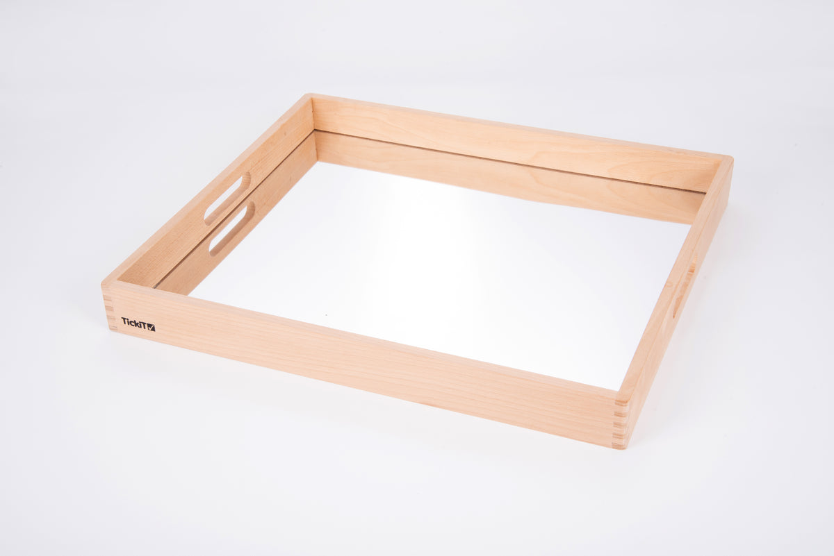 Wooden mirror tray with light wood frame and empty reflective insert, top view