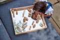 Wooden mirror tray with light wood frame and reflective center for play