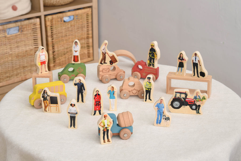 Wooden people figurines and vehicle blocks with hospital, farm, and fireman figures