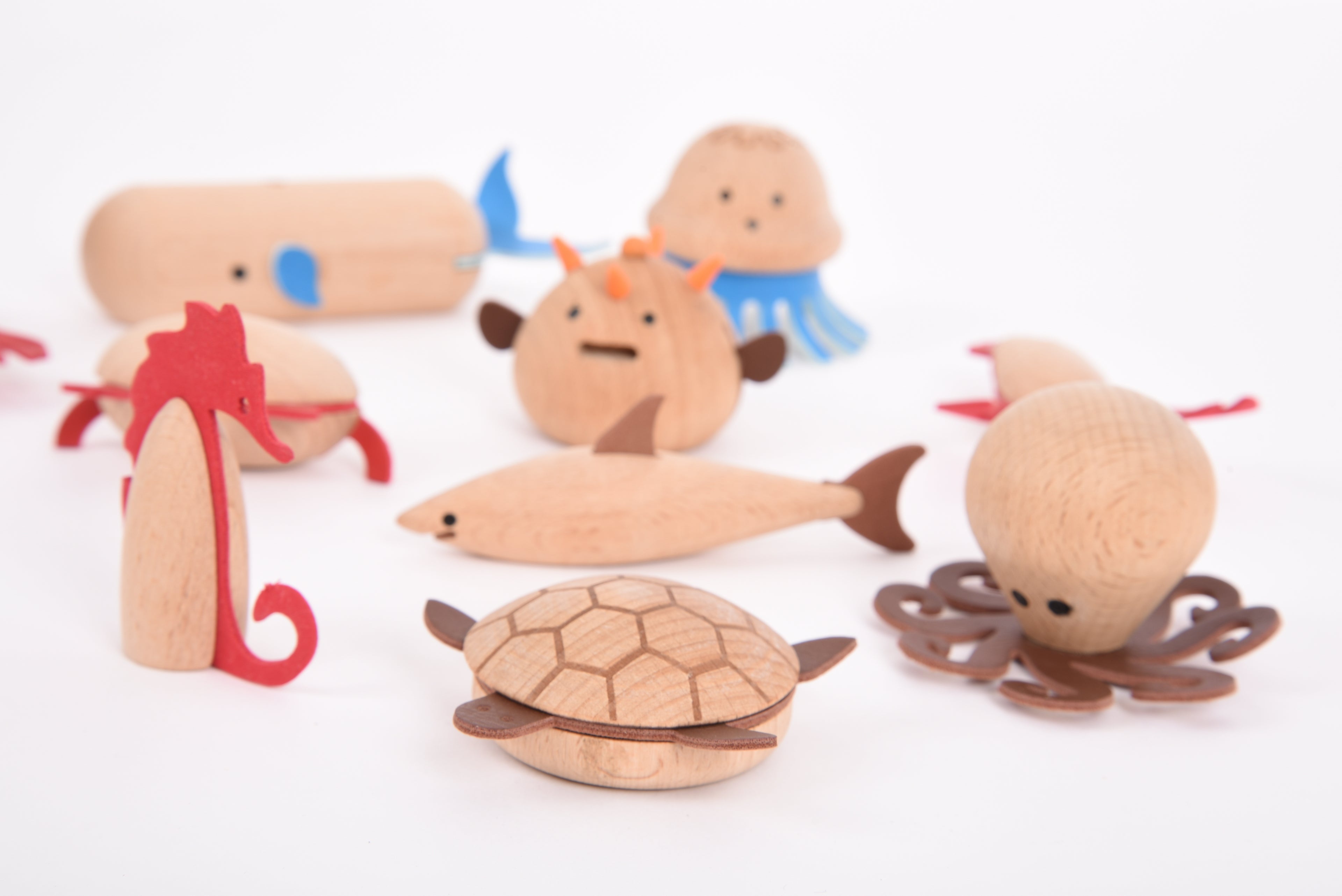 Wooden sea creature set with assorted figures, including whale, seahorse, crab, and turtle