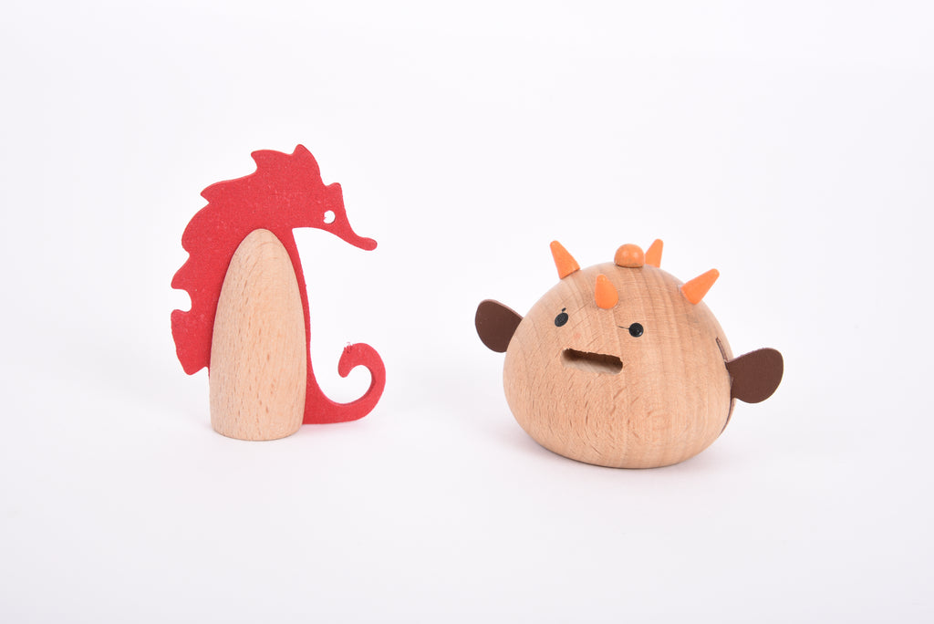 Wooden sea creature figurines: red seahorse and orange puffer fish