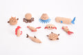 Assorted wooden sea creature figurines: octopus, jellyfish, turtle, fish, and more