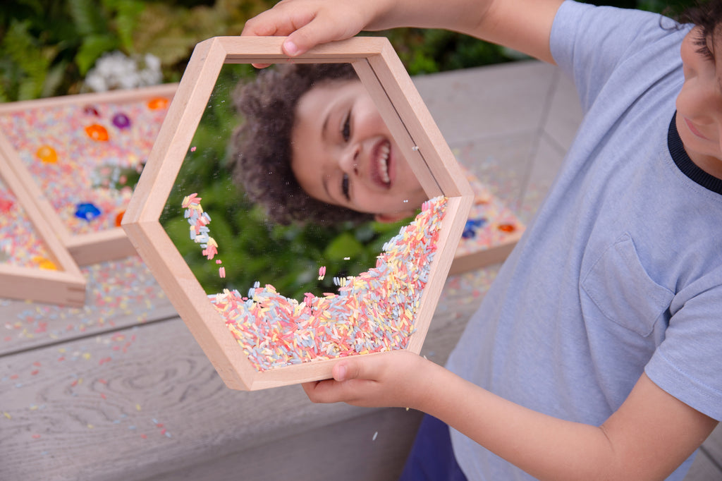 Wooden mirror tray set of 4 with light wood frames and clear mirrors, colorful pieces scattered