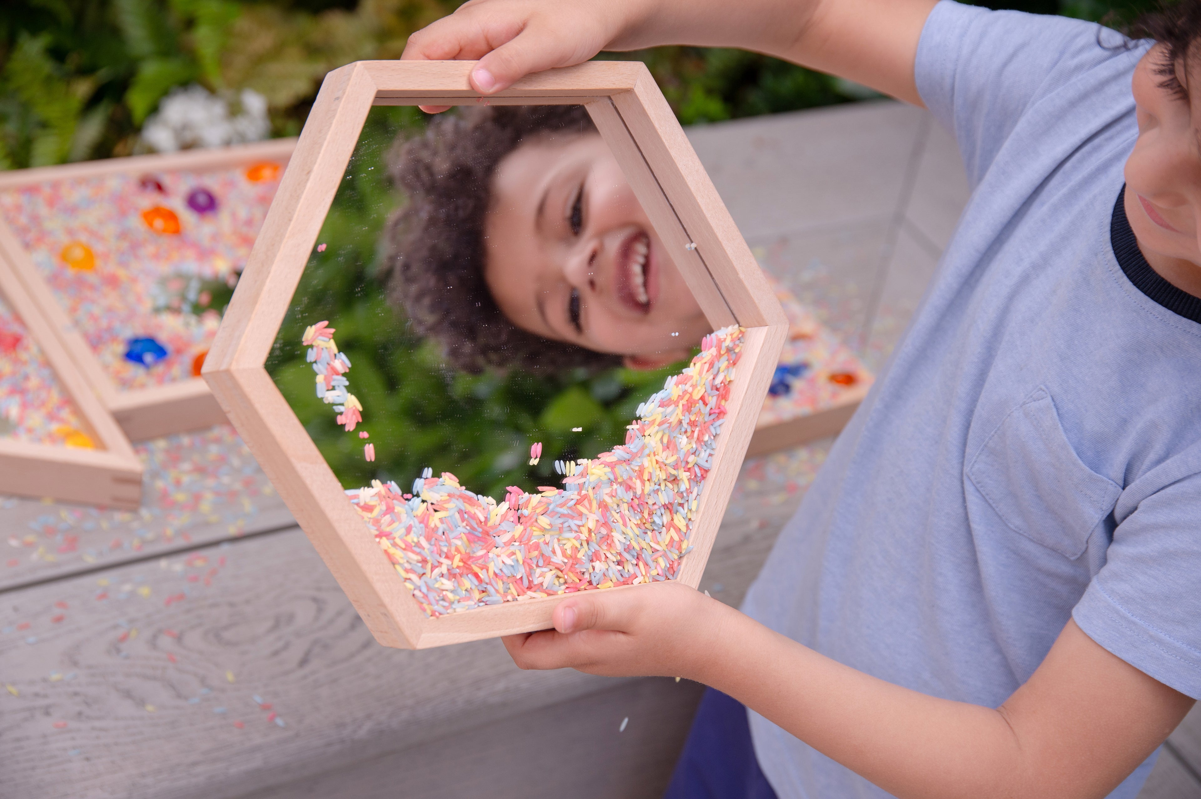 Wooden mirror tray set of 4 with light wood frames and clear mirrors, colorful pieces scattered