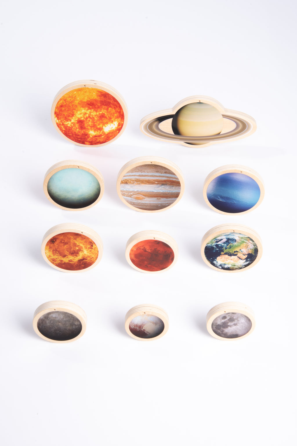 Wooden solar system discs set with a Saturn ring disc, Earth, and several smaller moons