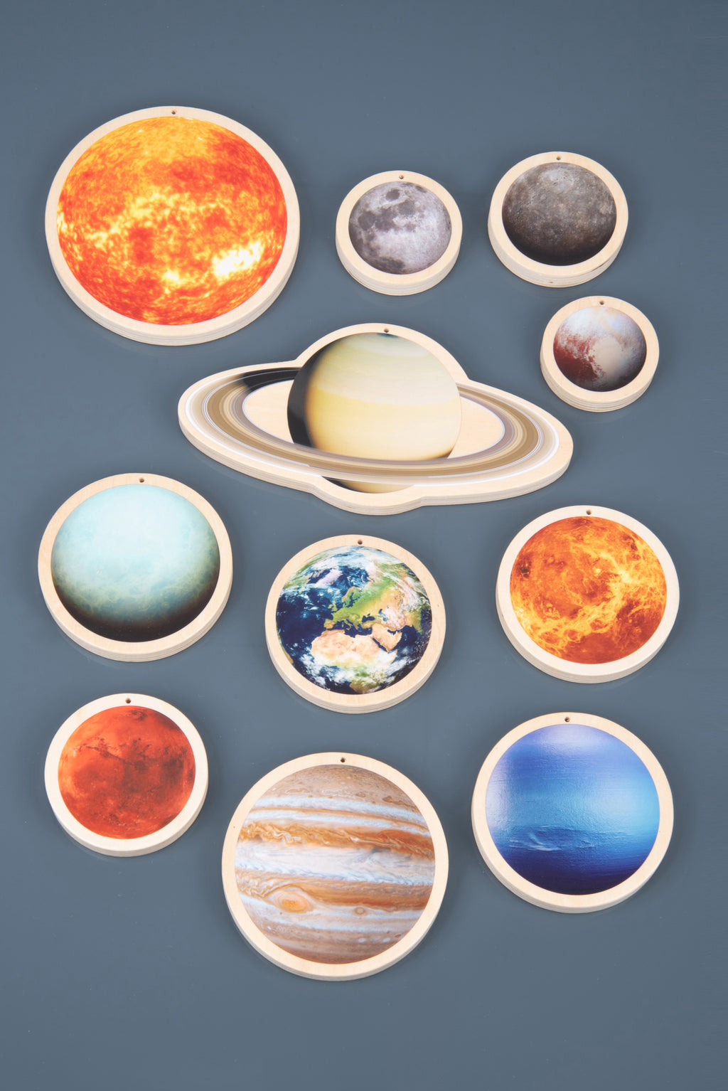 Wooden solar system discs with Sun and Saturn ring discs, plus planet and moon designs