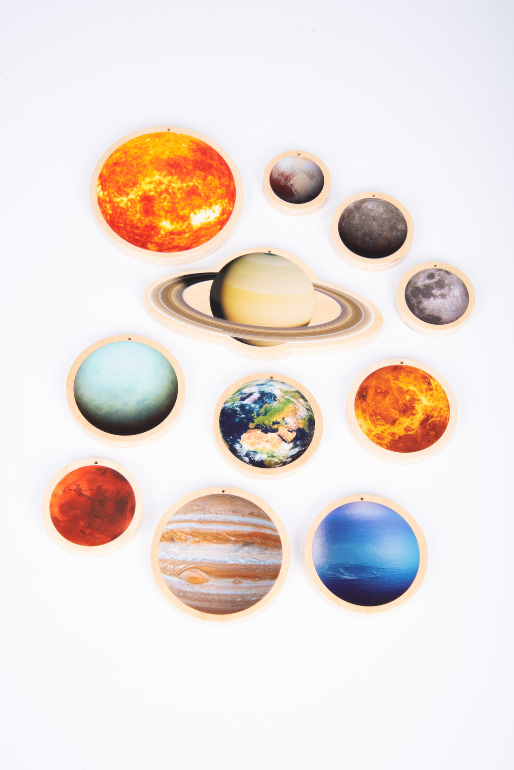 Wooden solar system discs in a clustered layout, with Saturn rings and planet/moon discs