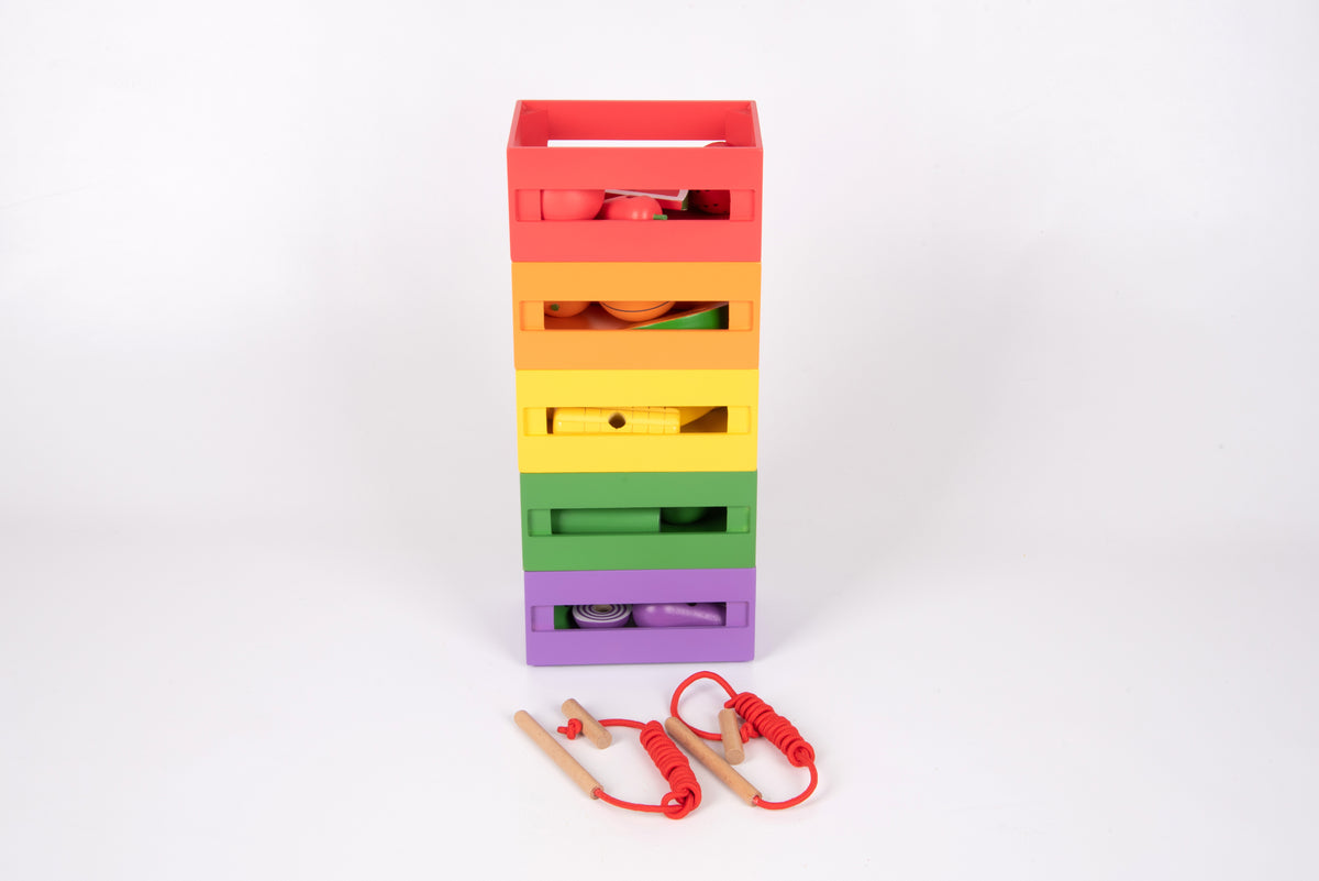 Rainbow wooden sorting crate stack with toy produce pieces and red lacing accessories
