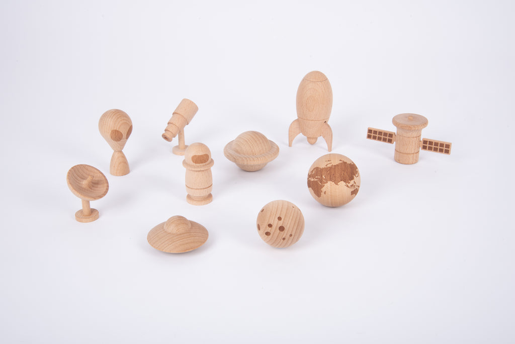 Wooden space play set layout with astronaut, planet spheres, rocket and rover figures