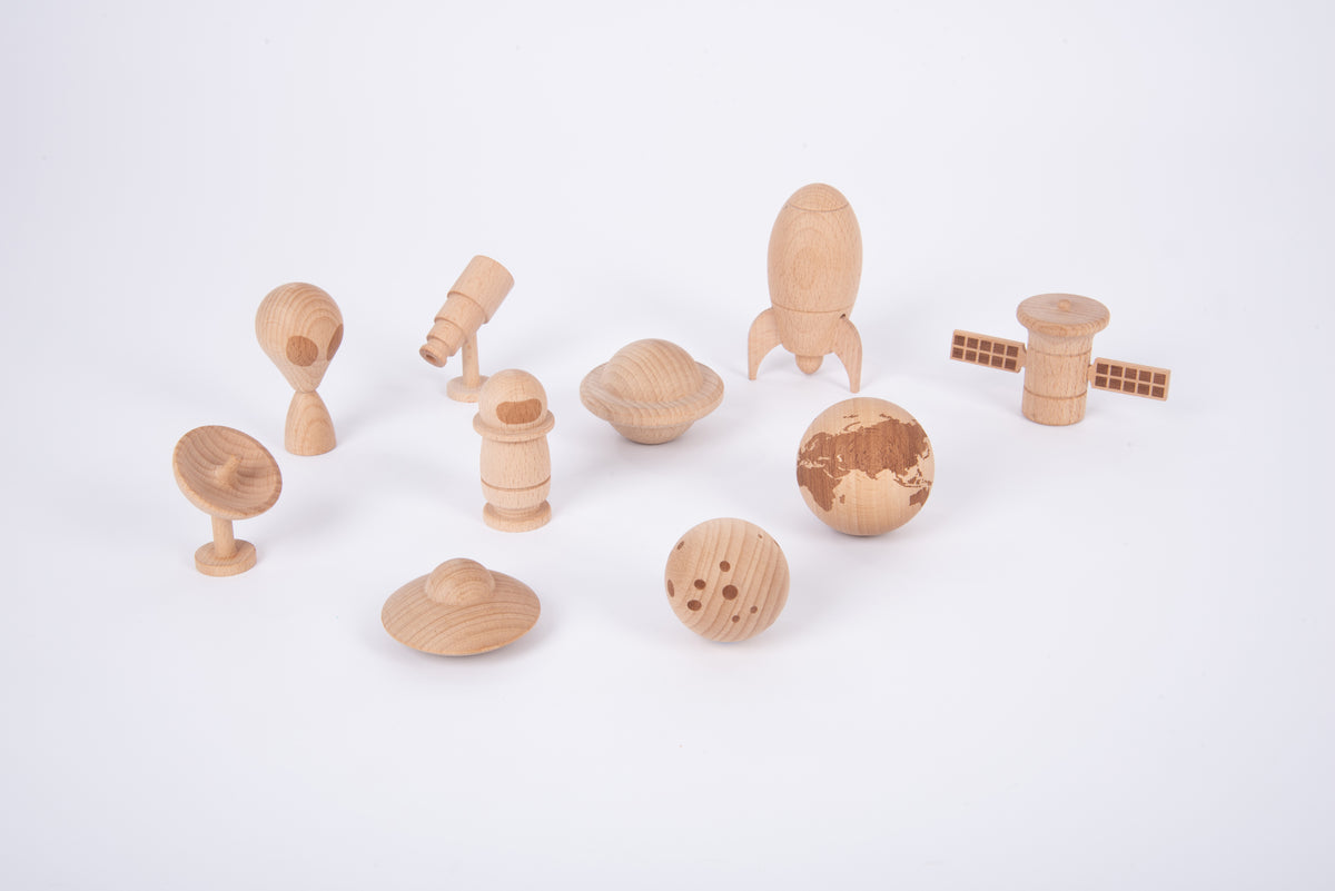 Wooden space play set layout with astronaut, planet spheres, rocket and rover figures