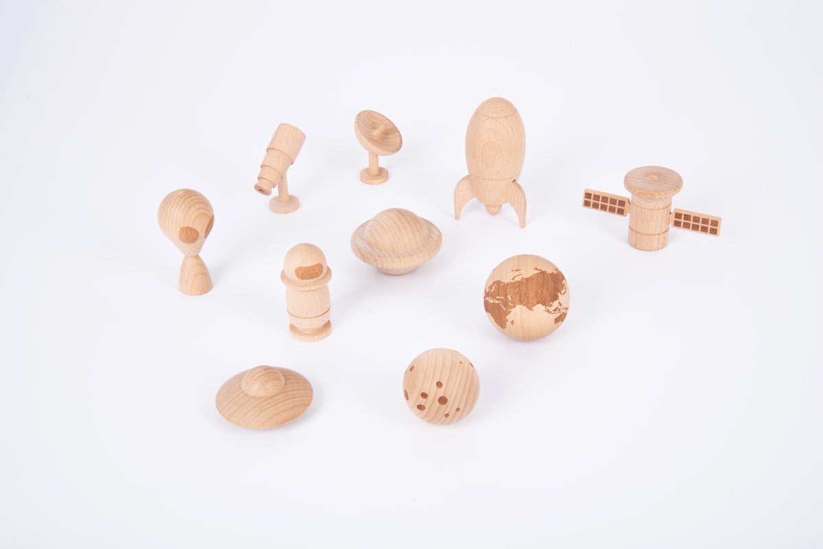 Wooden space play set with astronaut, planets, rocket and rover pieces in light wood