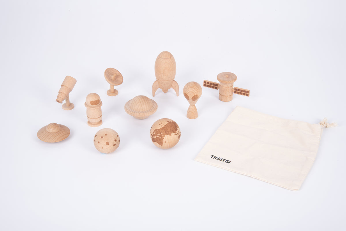 Wooden space play set with astronaut, planet pieces, rocket, rover, and storage bag