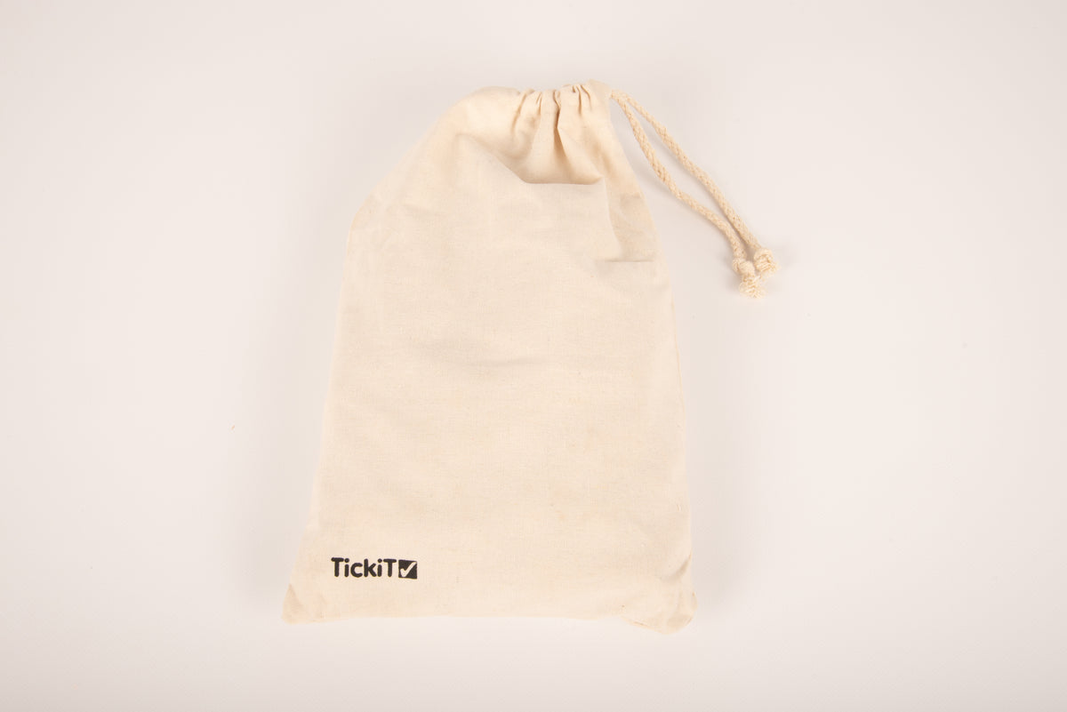 Natural canvas drawstring pouch with TickiTv logo and light tie cord