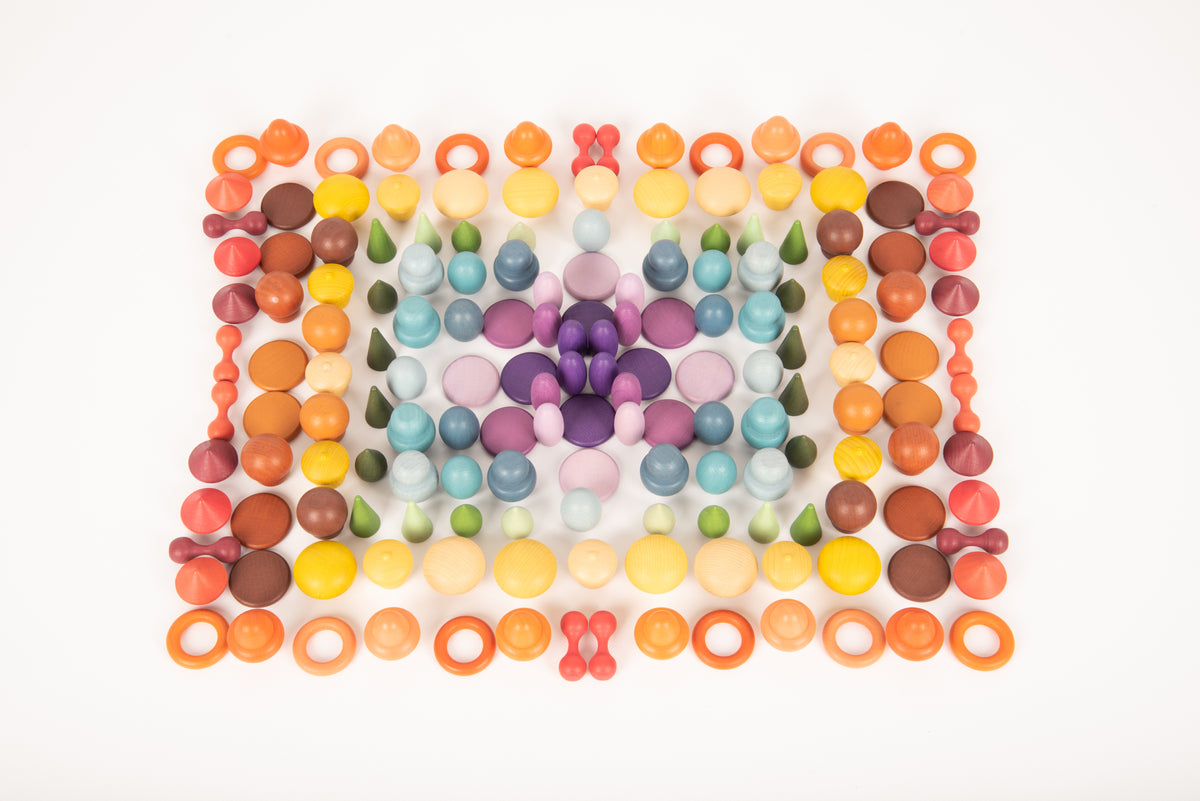 Square wooden peg pattern with multicolor beads, including orange, purple, and green sections.