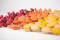 Assorted wooden cone-shaped pegs in red, orange, and yellow