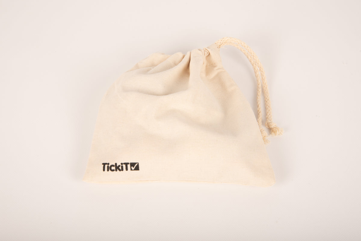 Cream cotton drawstring pouch with TickiT logo, closed top