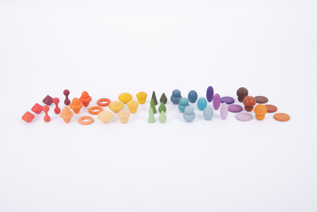 Row of assorted wooden pegs and rings in rainbow colors