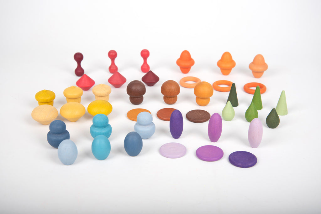 Assorted wooden pegs and shapes in red, orange, green, blue, and purple