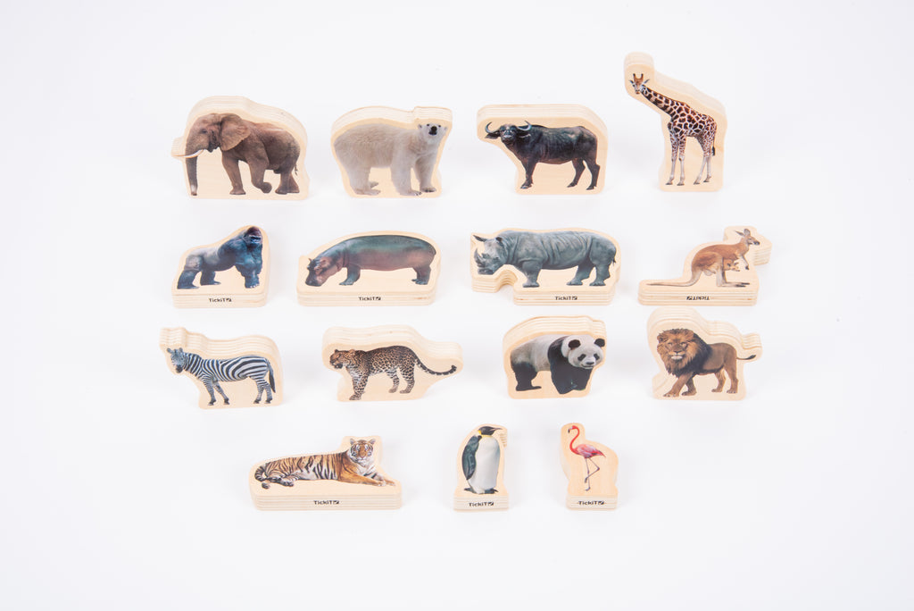 Wooden wild animal blocks laid out on a white background, featuring assorted animals