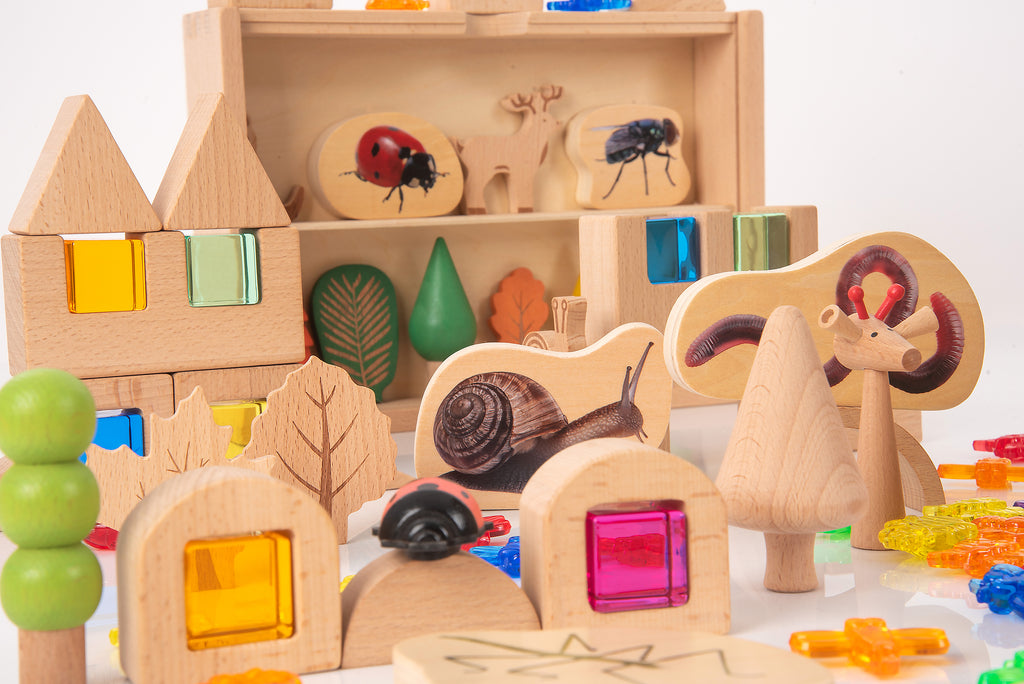 Wooden tunnel and windows on the woodland playset with snail, beetle, and rabbit figures