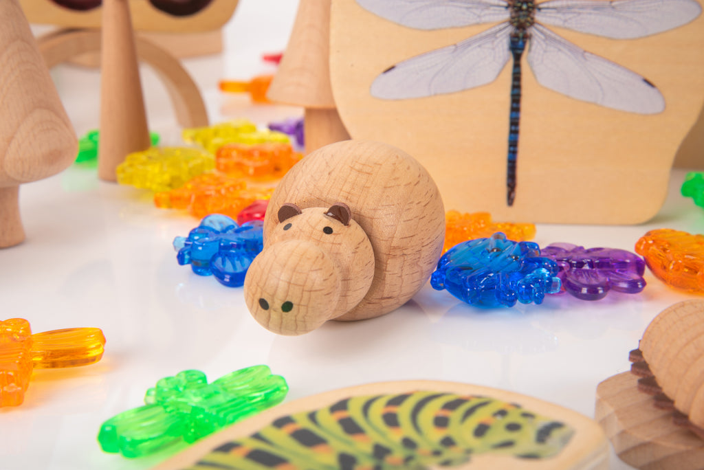 Wooden insect-themed rolling figure with bead tracks and dragonfly-shaped board