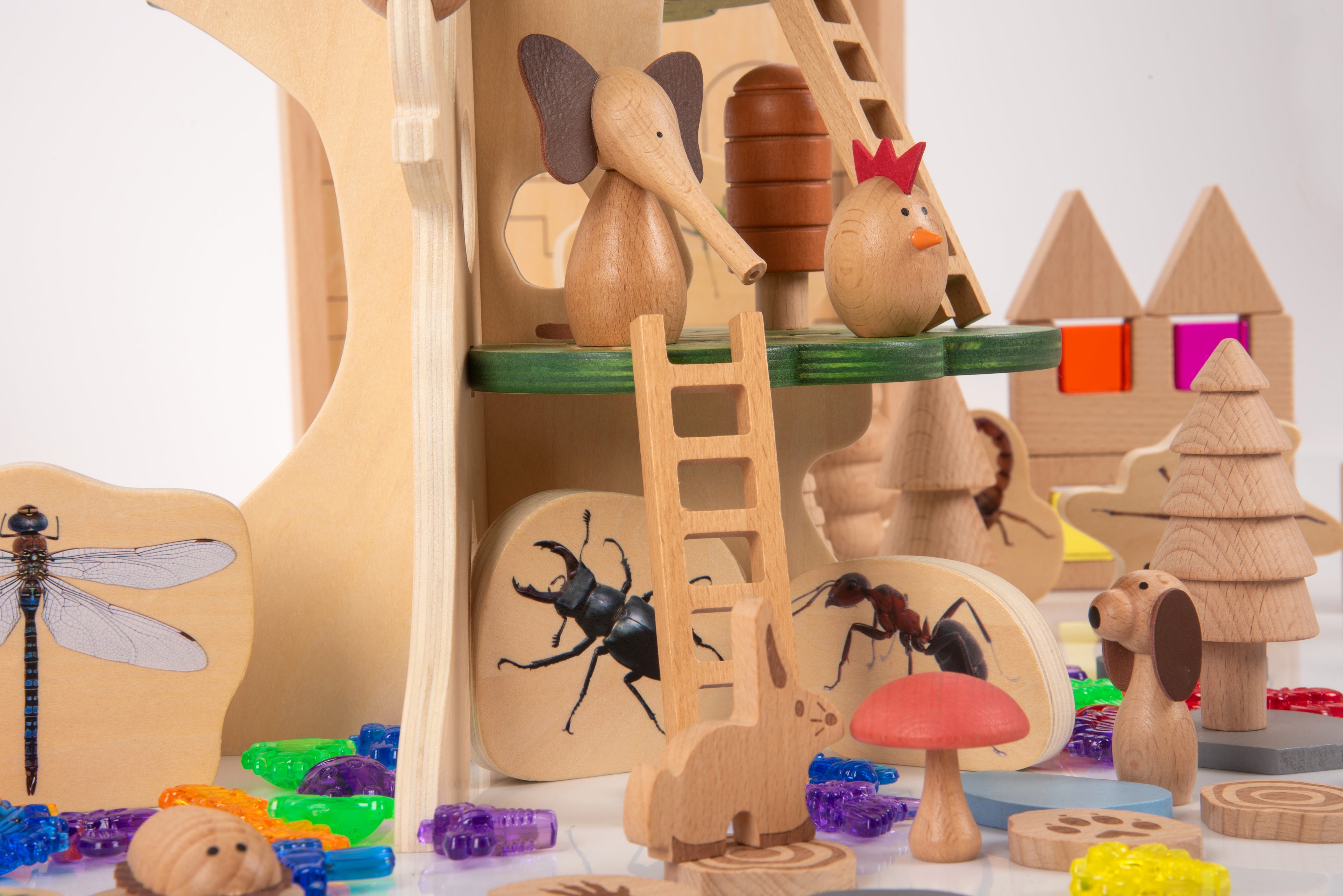 Wooden forest playset with mouse and squirrel figures, ladder piece, and curled worm accents
