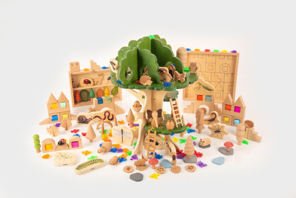 Wooden woodland playset bundle with treehouse, animal figures, and colorful accessory pieces