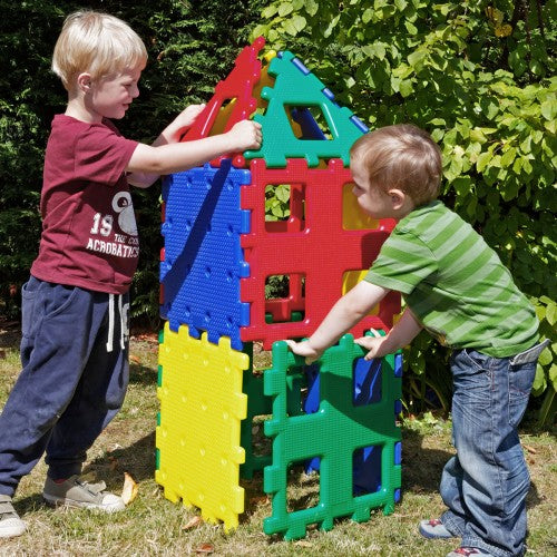 Colorful interlocking building block set with panel pieces and window cutouts